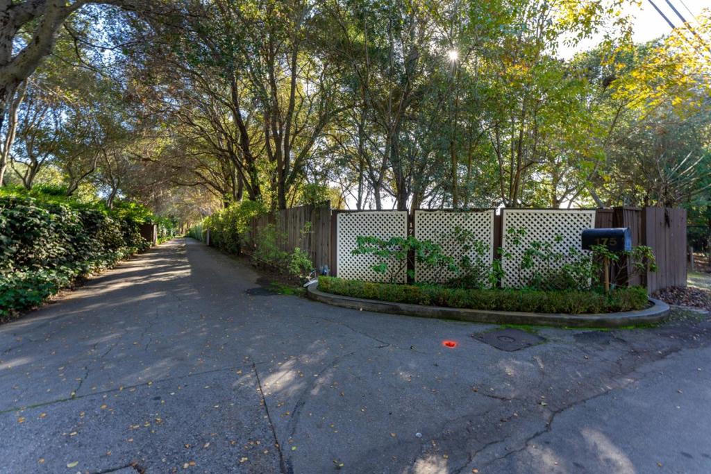 Secluded property in Menlo Circus Club location. Set far back off the street on a tree canopied drive, the home enjoys privacy, tranquility and a magical setting. Lovely, single story home on a flat lot surrounded by mature trees and lush greenery. Situated in an idyllic setting, the home is located on one of the most sought after streets in the Menlo Circus Club area. Build new or move into this swanky, Mad Men era home. Current survey available. Boundary markers in place.