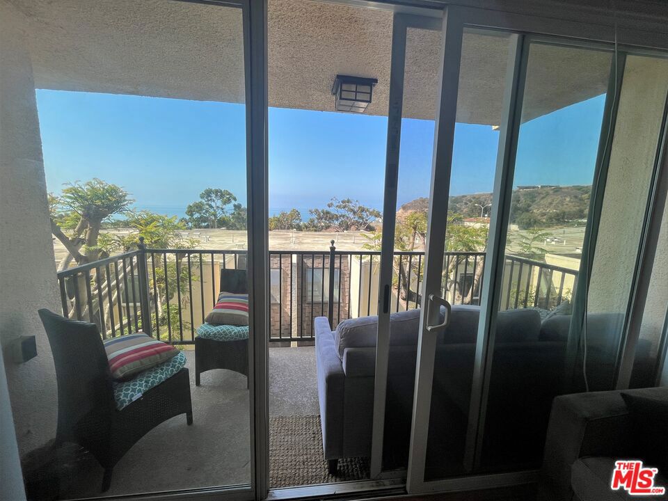 This 2 bed, 2 bath apartment has incredible ocean views, and is located in the gated Malibu Canyon Village with access to a tennis court, pool, and gym. The open floor plan includes a dining area, kitchen with a breakfast bar, and living room area. The living room balcony offers ocean views. Both bedrooms have en suite bathrooms for added privacy. Located near Pepperdine University, shopping, and restaurants. The unit has two covered assigned parking spots.