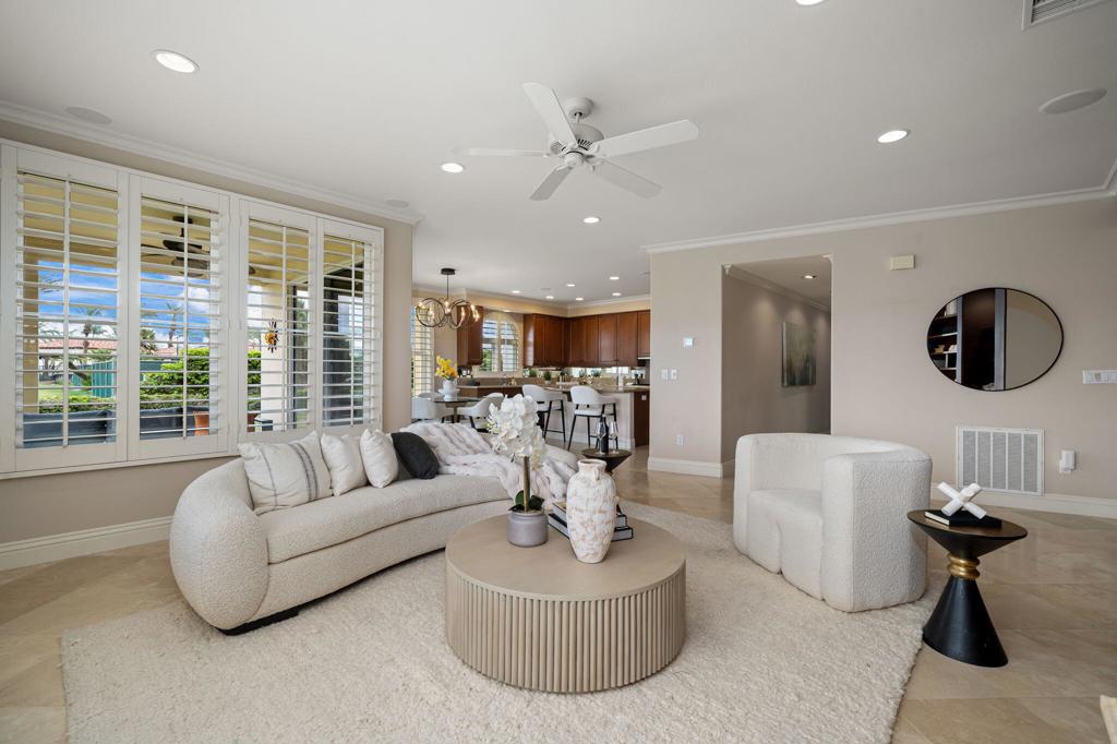 Luxury Condo in Mountain View Country Club, La Quinta, California3 Bed | 3.5 Bath | Prime Golf Course LocationWelcome to your dream desert retreat! This beautifully appointed 3-bedroom, 3.5-bath condo is a rare new listing located on the 9th hole of the prestigious Mountain View Country Club in La Quinta. Enjoy sweeping views of the fairway and green from your private patio in one of the most sought-after locations within the community.Inside, you'll find elegant travertine flooring throughout the main living spaces, complementing a gourmet kitchen equipped with high-end KitchenAid appliances, granite countertops, a spacious island, and stylish bar seating--perfect for both cooking and entertaining.Each bedroom is en-suite, offering ultimate privacy and comfort. The expansive primary suite includes a spa-like bathroom with a soaking tub, separate shower, dual vanities, and a generous walk-in closet with built-ins. Two guest bedrooms each feature private baths, plus there's an additional powder room for guests.Additional features include a large laundry room with a deep utility sink, and a built-in office space tucked away for productivity without intrusion.Located at the end of a quiet cul-de-sac, this home offers both privacy and convenience, just steps from the tennis and pickleball courts.Community Amenities Include:Championship golf courseVibrant clubhouse with fine dining and year-round eventsState-of-the-art fitness center with yoga, Pilates, and spin classesOlympic-size pool with aquatic classes8 meticulously maintained pickleball courts with vibrant organized playTwo Tennis courts just steps away from your condoLive the resort lifestyle in one of La Quinta's most desirable gated communities. Schedule your private tour today!There is a one-time membership transfer replenishment fee paid for by buyer $10,000Condos in Mountain View Country Club are currently being repainted exterior. New colors are fabulous!