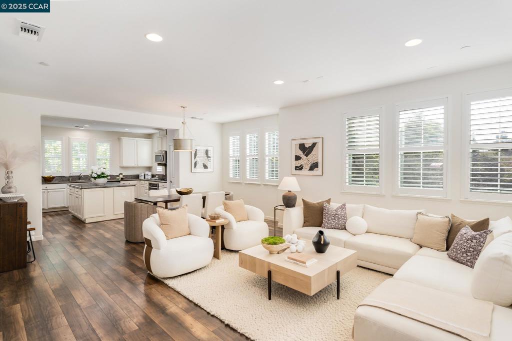 End unit home in the sought after Emerald Vista neighborhood of Dublin. Discover a private full bed and bath on the ground level and an expansive great room upstairs. The beautifully appointed kitchen offers a water filtration system, built-in stainless steel appliances, an abundance of cabinetry and a center island—seamlessly flowing into the spacious dining area and family room. This home is complete with 3 bedrooms on the top level—the primary bedroom retreat and 2 secondary bedrooms with a shared hallway bath. Perfectly situated near parks, scenic trails, shopping, dining, and top-rated schools—Frederiksen Elementary, Wells Middle School, and Dublin High School. This location also offers convenient access to I-580, I-680, and the Dublin BART station.