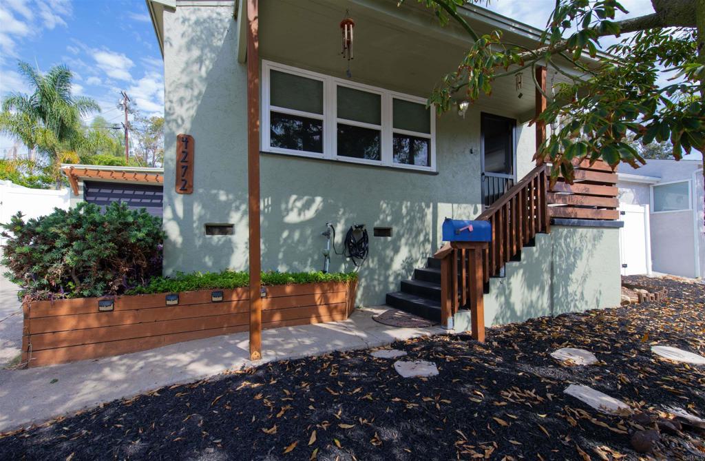 Welcome to this stunning 3-bedroom 2-bath La Mesa home. Step through the custom front door into a light-filled interior with spectacular kitchen that truly WOWs. Thoughtfully designed for style and convenience, this home is filled with large windows that capture natural light and fresh breezes. Additional updates include newer kitchen appliances with ventless stove, white quartz counter tops and lots of storage. New exterior paint and new fence. The spa-like primary bathroom was recently renovated with modern finishes, dual sinks & anti-fog LED dimmable lighted mirrors creating a private retreat. Buyer will enjoy PAID SOLAR with low electric bill. One bedroom has been converted into office/ laundry, with built in floor-to-ceiling cabinets, desk & laundry hookups added to room, which can easily be converted back. Ideally located just minutes from downtown La Mesa, with easy access to shopping, dining, and freeways. A rare find you won’t want to miss!