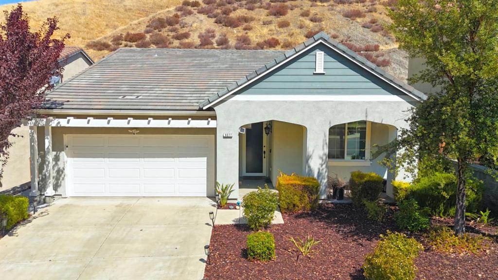 Discover modern comfort in this beautifully upgraded 3-bedroom, 2-bathroom home with 1,786 sq ft of thoughtfully designed space. The gourmet kitchen features quartz countertops, upgraded cabinets, under-cabinet lighting, and stainless steel appliances, perfect for everyday living and entertaining. Enjoy the cozy fireplace, LED recessed lighting, and ceiling fans throughout, creating a bright and inviting atmosphere.  Luxury touches include upgraded flooring, custom blinds, a front security screen door, and upgraded door and bathroom hardware. The primary suite boasts a spa-like feel with a custom shower door.  Step outside to a fully landscaped backyard oasis with drip systems and sprinklers in both front and back for easy maintenance. The epoxy-coated garage floor adds durability and style.  Meticulously maintained and truly move-in ready, this home blends style, comfort, and convenience, all thats missing is you!