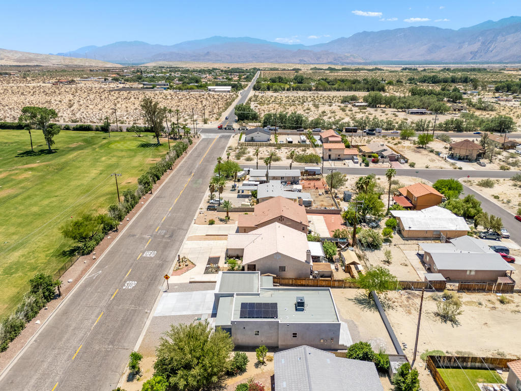 Now Available for Lease - Brand New 2025 Modern Construction | Solar | Golf Course Views | No HOAExperience upscale desert living in this brand-new, all-electric home with scenic golf course views and no HOA. Perfectly located at the entrance of Desert Hot Springs--just minutes from Palm Springs and I-10--this thoughtfully designed home offers privacy, modern finishes, and energy efficiency.Positioned directly across from a golf course with no front neighbors, the home features a sleek, contemporary design with large-format tile flooring throughout and a fully owned solar system. The open-concept kitchen includes flat-panel cabinetry, a waterfall quartz island, stainless steel appliances, and a walk-in pantry.All bedrooms open to the backyard through sliding glass doors, blending indoor comfort with outdoor living. Bathrooms are styled with frameless glass walk-in showers and floating vanities for a clean, spa-like feel. The backyard includes poured concrete steps and expansive flatwork--ideal for gatherings or relaxation. A wide driveway and finished two-car garage complete the offering. Call for any question.