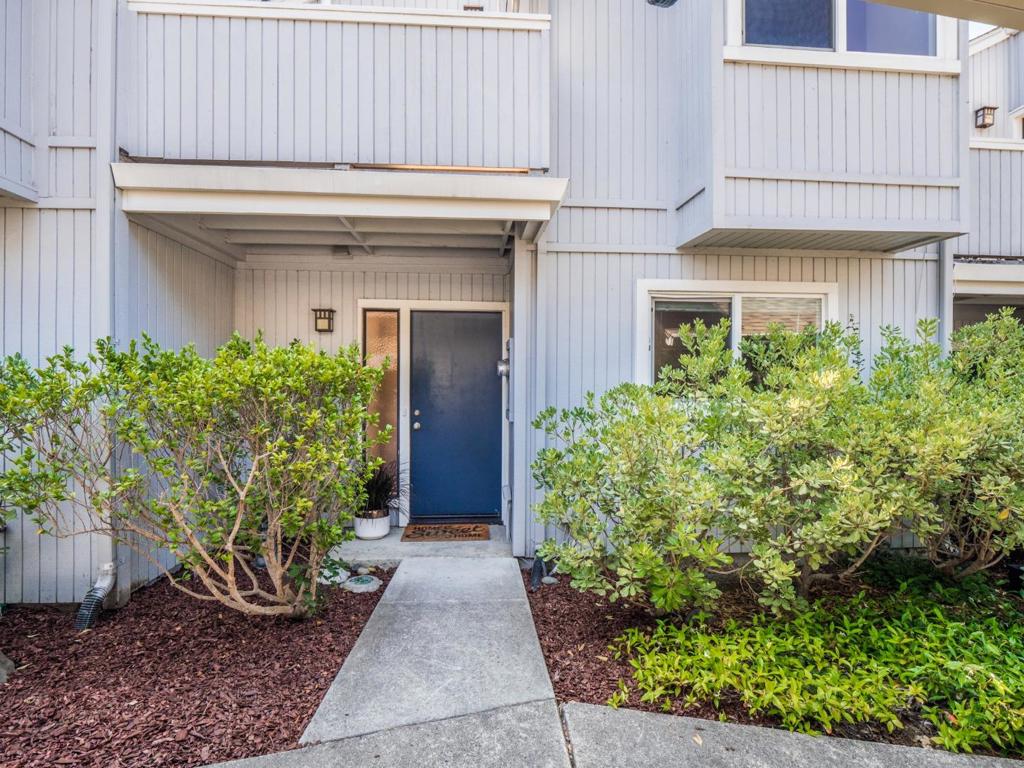 Nicely located in the heart of the Live Oak. This 1200 sq. ft townhouse has an inviting open floor plan with two sunny bedrooms up & an "office" on the lower level. Use as a bedroom as it has a large closet and access to the patio. Living room & very workable kitchen open together with access to the patio giving you a nice spot for morning coffee, evening wine & BBQing! Work from home in the sunny office on lower level. Upper floor features vaulted ceilings with wood beams adding volume to the rooms & architectural interest. Large closets in both bedrooms. One was access to a balcony. Full utility room has washer/dryer, tankless newer water heater, HVAC system & storage! Shopping/ services nearby along bus lines. Laminate wood flooring on bottom level and carpet above for quietness. Clean, freshly painted and lovely! Front of property faces east and back is west. The best exposure!