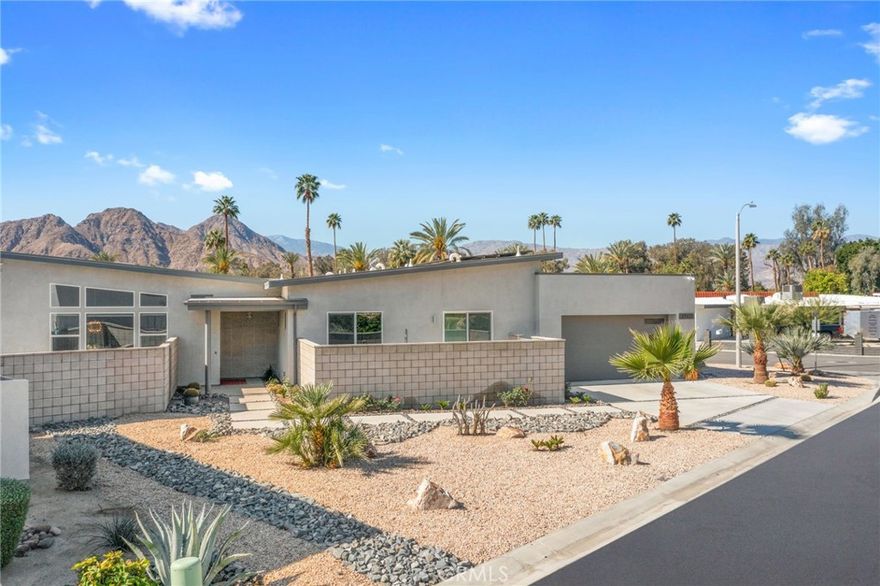 77431 Huntley, Blending mid-century modern charm with cutting-edge desert craftsmanship, this solar-powered Indian Wells residence combines timeless design with forward-thinking efficiency for year-round comfort. Next to the Indian Wells Tennis Garden, this home’s short-term rental opt-out status provides a rare opportunity for flexible investment in today’s increasingly restricted rental market.

Originally completed in 2020, this residence goes far beyond standard builder options. The gourmet kitchen features custom cabinetry, Jenn Air Noir appliances, a generous custom pantry, and a striking quartz waterfall island. Designer finishes extend through the open living space, with vaulted ceilings, expansive windows, and custom window coverings enhancing natural light and desert views.

The primary suite offers a private retreat with a spa-inspired bath featuring a deep soaking tub, zero-threshold rain shower with private patio access, and a custom-designed walk-in closet. Situated on one of the community’s largest, highest lots, the property provides enhanced privacy, premium drainage, and an engineered rainfall management system.

Additional highlights include whole-house Ecowater filtration, an advanced security system, and EMF protection. Outdoors, a custom pool with beach entry and dual Baja shelves is complemented by a Carrara marble fire table perfect for entertaining beneath the desert sky. Just minutes from El Paseo’s fine dining, luxury shopping, and world-class golf, this home offers the perfect fusion of design, efficiency, and resort-style living in one of Indian Wells’ best locations.