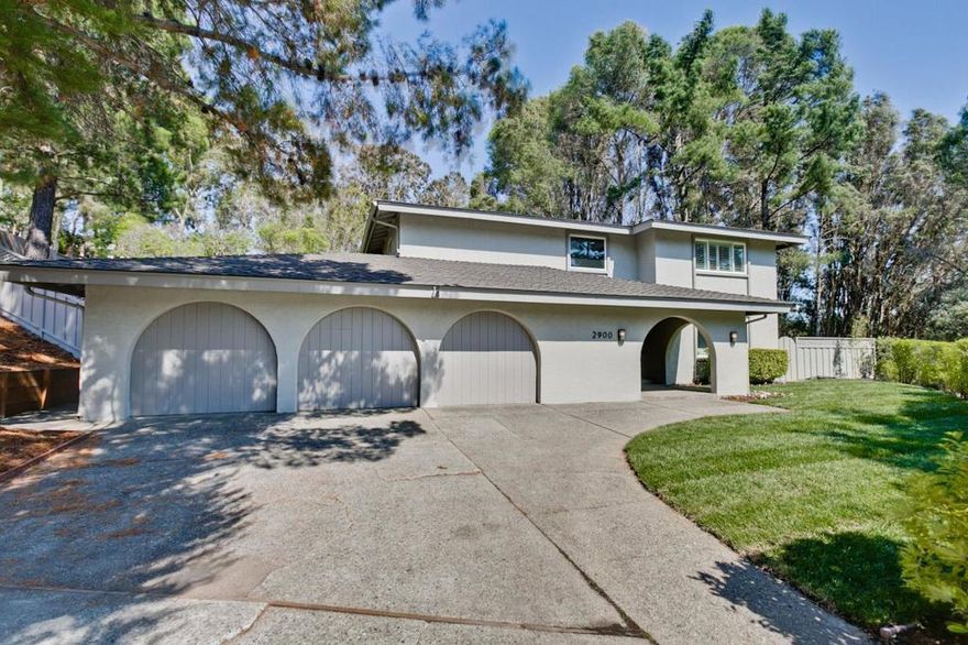 Exceptional 2 story residence in Hallmark adjacent to the beloved Water Dog Lake Trail. One of the largest & most expansive flat lots in the area. The formal entry is highlighted by a grand modern curved iron staircase. Upstairs, 4 spacious bedrooms & 2 beautifully appointed full baths. The primary suite is a luxurious retreat featuring an oversized balcony, generous custom closets &  a truly spa-like ensuite bath with a soaking tub, steam rm, oversized shower & double vanities. Downstairs is a sleek renovated kitchen opens into the family rm, anchored by a statement gas fireplace with TV mount and elegant picture windows on either side. The chefs kitchen boasts: An abundance of cabinetry, Professional-grade stainless steel appliances, Oversized refrigerator, gas cooktop, modern hood, double ovens, microwave & beverage refrigerator, Double sinks, eat-up breakfast bar & recessed lighting A wall of windows & French doors opening to the backyard. The adjacent living rm features a large picture window & dining room with recessed ceiling & modern designer light fixture. A dramatic powder rm, A spacious laundry rm. and a versatile 5th bedroom, ideal as a guest suite/home office. The lush, private backyard is a dream w/ expansive lawn, elevated wooden deck & a backdrop of mature trees.