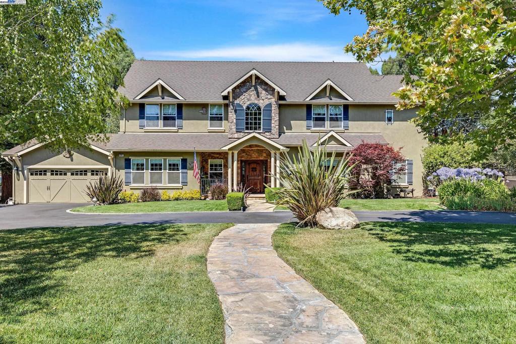 Experience the perfect blend of luxury & country charm in this exceptional property located in Pleasanton’s desirable Happy Valley area offering rural living just minutes from historic downtown and easy freeway access. This remarkable estate features a beautifully appointed main residence, a detached guest house, a 2-stall barn, riding arena, 13 x 35 covered RV storage, & multiple outbuildings. Thoughtfully designed for entertaining & everyday comfort, the main home boasts a gourmet kitchen with a large island, professional-grade appliances, custom cabinetry, a spacious pantry, & a wine nook adorned with a wrought iron gate. The inviting family room centers around a grand fireplace, creating a warm & welcoming atmosphere. The expansive primary suite serves as a luxurious retreat, complete with a private lounge area, spa-like bathroom, & a generous walk-in closet. Step outside to your ultimate backyard oasis, featuring a sparkling pool, custom covered heated pergola, & an outdoor kitchen island. 2-car attached garage plus detached, extra-deep 1-car garage with a workshop, and storage room. Ideal for extended family or guests, the detached guest house offers comfort, space, and privacy. The zoning allows for up to 2 horses or other large animals plus plenty of room for chickens.