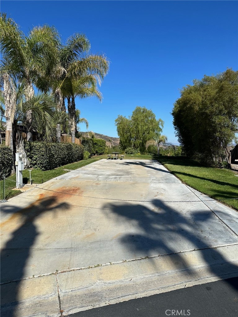 Wow Gargantuan Price Adjustment!!! This lot is Located in the Cul-De-Sac called the Mesa and is a pull-in Exclusive Class A only lot with incredible Westerly VIEWS!! Private Tree Lined Property ready for your ideas and plans. Sunsets are to die for.... Premier RV Resort located in SoCal minutes from Temecula Wine Country and close to San Diego, Oceanside and Palm Springs! Don't miss this one - priced competitively! Rancho California RV Resort offers a 14 hole PAR 3 executive golf course that is free for owners, (5) pools & jacuzzi areas, tennis courts, pickleball courts, laundry rooms, dog park, horseshoe lawn, exercise room, (2) clubhouses, hiking trails, grocery market all inside gated community that is guarded 24/7. *A MUST SEE* Financing Available....