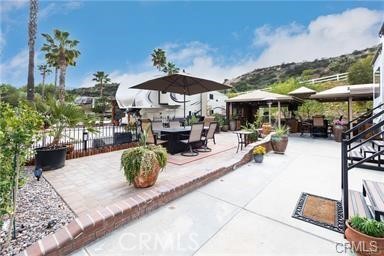 Sooooooo Cute and Homie... Lots of Cover and Outdoor space to Enjoy. Built-In BBQ, Washer/Dryer Hookups, Oven and Lots of Storage with 3 different spaces to use and Entertain - Kitchen, Family Room and Dining Area. Great Location, Close to Fishing Pond, Restaurant, Market, Pool, Front Entrance and Small Clubhouse. Rancho California RV Resort provides amenities such as a 14-hole Executive PAR 3 Golf Course (no fees for owners and unlimited usage), 5 Pools/Jacuzzis, Tennis courts, Pickleball courts, Dog park, Club house, hiking trails, Horseshoe lawn and onsite grocery market. The resort is guard gated with no age restrictions and just minutes from SoCal Wine Country! Convenient access to San Diego, Palm Springs, Oceanside and Los Angeles. *FINANCING AVAILABLE* RV ALSO 4SALE, Possible Package Deal...... Great Deal....