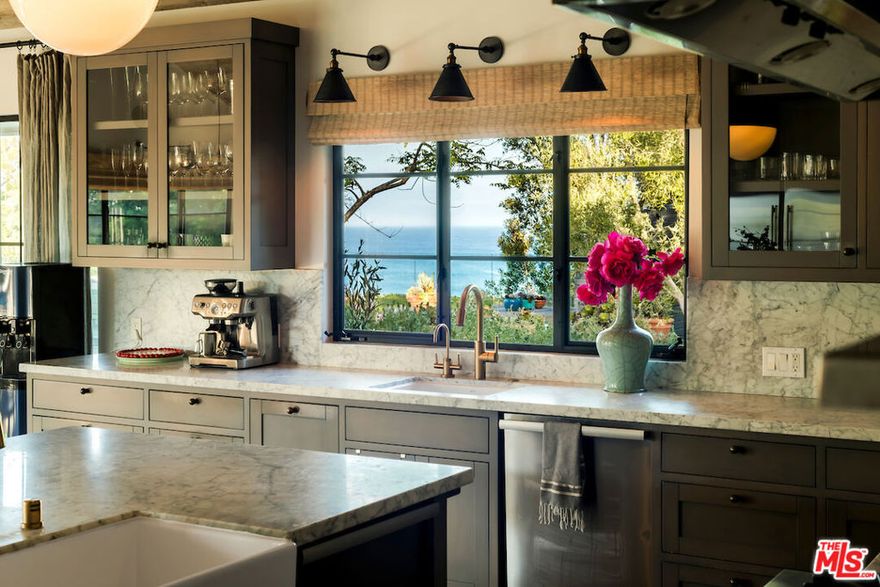 A once-in-a-lifetime Point Dume estate with rare deeded beach keyed access and a private backyard path to Little Dume. Elevated above the surf and nestled off and away from the bluff , this iconic one plus acre compound offers unobstructed and wind protected ocean views that span the entire estate. An irreplaceable and pristine home blending effortless luxury with resort-style living. Purposefully designed to include a sun-drenched pool, ocean-facing gym, a tucked away enclave with custom skate bowl, zipline and treehouse; and a designated surf-ready setup with outdoor shower and board locker. The elegant four-bedroom single level main home is paired with a private guest house above the four car garage, complete with a full kitchen and space to comfortably sleep four. Ocean facing and adjacent to the pool is a detached destination gym and a separate pool house that features a chef's kitchen, commercial-grade pizza oven, and built-in daybeds; ideal for post-swim lounging or overnight guests. This is not just a home, it is a haven for privacy and immediate enjoyment, designed for those who understand the value of the truly unrepeatable.
