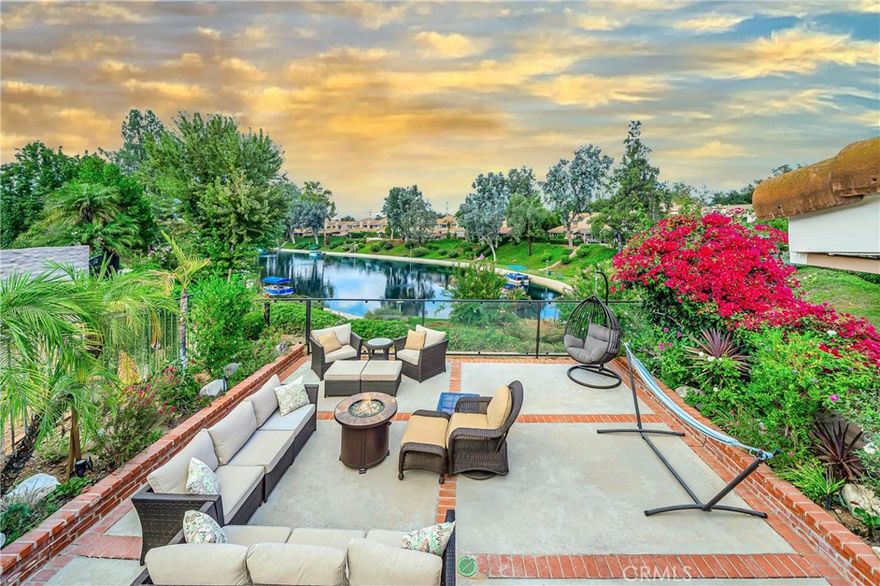 Calabasas lake living at its finest!  Location. Location. Location!!!  Rarely to be found, this lake home is renovated to utter perfection!  Located on a private cul-de-sac and near tennis courts, a swimming pool, spa and more! This renovated beauty exemplifies luxury lake living.  Inside find 3 bedrooms (1 down and 2 up). 3 full baths. The perfect combination of stone and wood floors. A fantastic chef’s kitchen with high grade Viking Appliances, sleek white cabinetry, modern stone countertops, open to the spacious living room, dining room and over looking the lake. Find 2 stone fireplaces, brand new bi-fold wall to wall folding doors.  Enjoy the upscale light fixtures throughout.  There is a conveniently located bedroom with full bath downstairs. A 2 car garage and designated laundry room. Upstairs find 2 additional bedrooms, renovated primary suite with a separate sitting room, spacious closet and a newly designed en-suite fit for a queen.   Wake up to Calabasas Lake views!  Don’t miss this rare find!