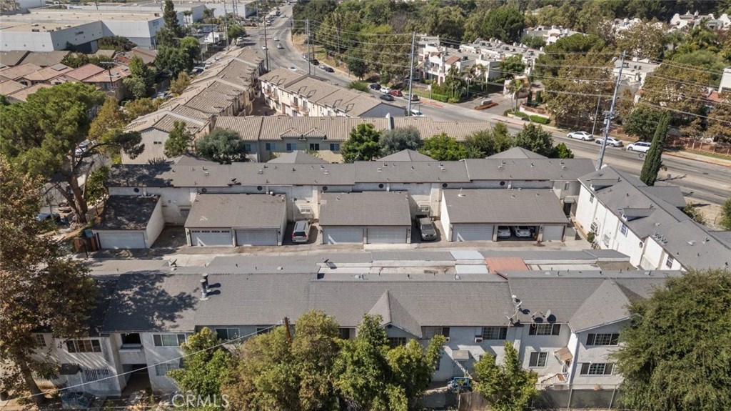 Discover this charming two-story condo, offering 1,070 square feet of updated living space in a secure gated community in Pacoima. Perfect for first-time homebuyers, this 2-bedroom, 2-bathroom gem includes a private 2-car garage and a cozy patio, ideal for outdoor lounging. Inside, enjoy modern finishes like tile and laminate flooring, recessed lighting, crown molding, and the comfort of central AC and heating. The open floorplan features a welcoming living room with decorative wall niches adding character, and a spacious dining area perfect for gatherings. Both bedrooms are bright and airy, with the added luxury of a private balcony off one room that offers a lovely street view. The bathrooms are equipped with stylish vanities and updated showers. You'll also appreciate the abundant storage space throughout the condo, as well as the convenience of an in-unit washer and dryer located in the garage. This prime location is close to Roger Jessup Park, Hansen Dam, Whiteman Airport, local schools, markets, and shops, with easy access to major freeways.