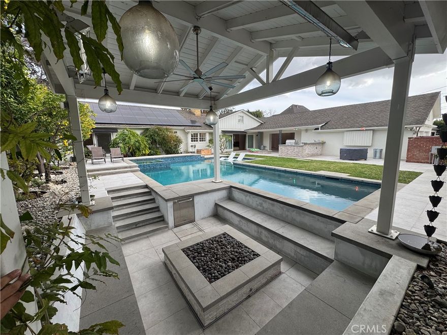 **Single family home in highly desirable neighborhood of Bixby Knolls**

Beautifully redesigned, this stunning single-story home sits on a large, elevated lot. Flooded with natural light, it features timeless finishes throughout. The spacious open living room offers soaring ceilings and 16 feet of sliding glass doors that disappear into the walls, creating a seamless indoor/outdoor flow to the inviting entertainment area. The gourmet chef's kitchen includes a professional 48" Viking range, two sinks, and a large center island perfect for gathering with family and friends.

The elegant primary suite overlooks a lush, private backyard with a sparkling pool/jacuzzi, built-in grill, and expansive sunken fireplace seating area ideal for hosting. Additional spaces include a dedicated family den, featuring custom sliding doors perfect for an indoor/outdoor experience. This area could also serve as an extra bedroom with an attached full bathroom. The home offers three fireplaces, three beautifully updated bathrooms, dual-zone air and heating, recessed lighting, and hardwood floors throughout. 

Located in the desirable Bixby Knolls neighborhood, this home is part of a welcoming community with a high walk score. Enjoy strolling to nearby restaurants, cafes, parks, and schools, with shopping and freeways just minutes away.

Washer/Dryer, Outdoor TV and remaining furniture are complimentary, repair or replacement is not covered by ownership. If you would like to have them removed we can accommodate.

One year lease. No smoking. Pets are negotiable, please call for details. Tenant responsible for all utilities. Owner responsible for landscaping. Household gross income 2.5x monthly rent. Good credit required to rent. This home won't last long, call us right away to view!