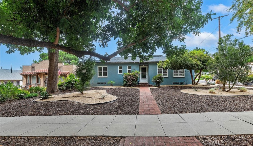 Welcome to 4494 9th Street, a charming 1939 Colonial Bungalow in one of Riverside’s most premier and highly sought-after locations—at the corner of Redwood and 9th, nestled at the base of Mt. Rubidoux. Surrounded by beautiful historic homes on a picturesque tree-lined street, this residence offers the perfect blend of timeless character and modern convenience.
Inside, you’ll find restored hardwood floors throughout, a beautifully remodeled kitchen, two spacious bedrooms, and remodeled bathroom. A large bonus room provides incredible flexibility—ideal for a third bedroom, home office, or Family room. Thoughtful details throughout highlight the home’s craftsmanship and charm including a cozy fireplace and plantation shutters.
The backyard is a true retreat, featuring a sparkling pool, low-maintenance landscaping, and unbeatable views of the Mt. Rubidoux Fourth of July fireworks show—all from the comfort of home. Energy-efficient solar panels and a recently painted exterior with special Cool Tech reflective paint add value and peace of mind.
This is a rare opportunity to own a home with historic charm, modern upgrades, and a premier location in the heart of Downtown Riverside. Don’t miss it—schedule your private tour today!