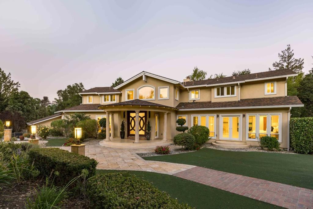 Sanctuary awaits on over an acre. Beyond an extended driveway lies a spectacular estate that has been meticulously upgraded to perfection. With a flawless blend of opulence and warmth, the nearly 7,200 sf of space invites grand-scale entertaining while providing all the comforts of daily living. Virtually every lifestyle need has been considered, from generous gathering areas and a gourmet kitchen to an executive office, a sprawling game room, a cinema-quality theater, and lavish bedrooms highlighted by a retreat-inspired primary suite. All-encompassing grounds reflect the lush surroundings, offering a five-star resort experience complete with an indoor/outdoor pool and a lighted tennis court. And though you will feel tremendous privacy inside of its gates, this estate is conveniently located mere minutes from downtown Los Altos and an esteemed country club, with access to sought-after public and private schools (buyer to verify eligibility).