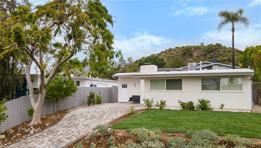 Don't miss out on the chance to visit this beautiful single-story Tujunga gem! The property features a sparkling in-ground pool with mountain views, and a generous 5,900 sq. ft. lot. The spacious 3 bedrooms and 3 full bathroom floor plan has been thoughtfully laid out across 1,313 sq. ft. of living space offering a turnkey home that boasts comfort, style, and function all in one.



As you step inside you're welcomed into an open-concept layout filled with natural light, where the bright living room flows effortlessly into the backyard through a sliding glass door inviting a perfect for indoor/outdoor living space right for feeling at home and entertaining guests. The modern kitchen design is complete with quartz countertops, stainless steel appliances, tile backsplash, and ample cabinetry for the culinary enthusiast.



Retreat to a serene primary suite with a walk-in closet and spa-like ensuite bath featuring floor-to-ceiling tile. The other bedrooms offer generous space, large windows, and ample storage. Step outside to your private entertainer’s paradise, with lush greenery, brick pavers, a large gardening area, and of course, that inviting pool.



Enjoy central air and heat, in-unit laundry, recessed lighting, and laminate flooring throughout. Tucked away on a quiet street in the foothills with sweeping views of the mountains and city lights, yet minutes from DTLA, Glendale, Pasadena, and Burbank you'll discover that this location offers just the right amount in both peace and convenience. Visit this magnificent property during open house hours or book a tour today!