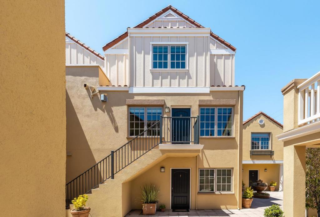 Welcome to 1705 Palm Avenue #19, a stunning corner-unit townhouse-style condo that perfectly blends modern elegance and comfortable living in San Mateo. The light-filled, open-concept floor plan features beautiful hardwood floors and a cozy fireplace, creating an inviting atmosphere. The gourmet kitchen is a chef's dream with white shaker cabinets, black granite countertops, and high-end stainless steel appliances. This unique layout offers two private retreats: one ensuite bedroom on the main level and a second luxurious ensuite bedroom upstairs, plus a spacious landing perfect for a study or office. The convenience of in-unit laundry and a deck for relaxing outdoors add to the home's appeal. Centrally located, this home is just moments away from the thriving shops and dining of downtown San Mateo, as well as Hillsdale Shopping Center, Trader Joe's and Whole Foods. Commuting is a breeze with its close proximity to public transportation and easy access to Highway 92. The unit also includes two dedicated parking spaces and storage in the secure garage. With HOA fees of $438.74, this exceptional property offers a prime lifestyle opportunity.
