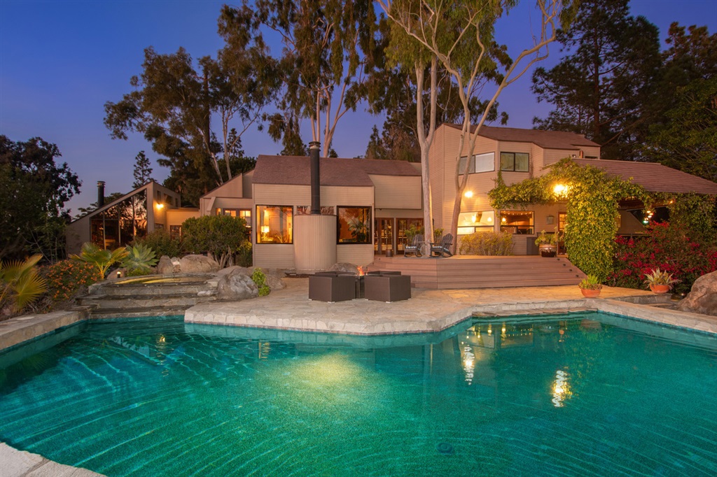 1.259M-1.349M. Your exclusive paradise awaits! One of a kind American Wood Council Idea House offers you contemporary architecture while still having a warm & welcoming feeling. Behold the spectacular, sweeping views from almost every room & from the private oasis backyard. The floor to ceiling windows naturally illuminate the entire estate. Gourmet kitchen w/ New Sub Zero Fridge, six burner Wolf Range & more. Grand Master Suite is multi-level w/ private spa off the balcony and pool. A must see! See supp. If you have been looking for a house that stands out from the rest, look no further. This property offers luxury, functionality and privacy. Cedar planks inside and out. Custom gourmet kitchen with granite counter tops, NEW Sub Zero fridge, six burner Wolf range, new dishwasher, warming drawer, large built-in custom table with bench seating and panoramic mountain views from every window. The backyard oasis is an entertainer's paradise! Relax the day away poolside or from one of the two spas while you watch one of San Diego's finest sunsets. The backyard has endless possibilities with tons of open space complete with Built-in BBQ and large palapa. Multi-level Grand Master Suite with over-sized skylights, sitting room with fireplace and built-in book shelf. Master bathroom with sitting vanity, walk-in closet, custom shower, and Jacuzzi bathtub. Large laundry room with ample storage. Summer time ready with 2 Brand New HVAC units just installed! Mature orange, grapefruit, lime and pomegranate trees line the side of the house. Beautiful boulder formations. Per seller, new roof put on in 2010 including fire resistant tiles. New windows and all new exterior including fire resistant siding, decking and all new skylights. Pool has been refinished with new pump, salt system and grid filtration system. New carpet upstairs. All this and more set on a one acre and in the Poway Unified School District with no Mello Roos. A true must see!. Neighborhoods: The Trails Other F...
