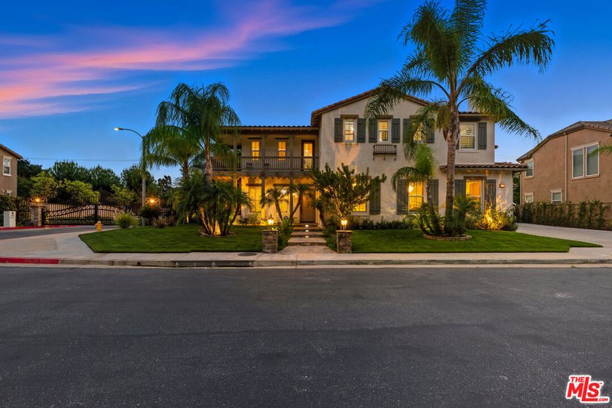 Step into this stunning 5-bedroom, 5.5-bathroom Chatsworth residence, nestled in the gated enclave of Stonehaven Estates. With just under 4,500 square feet of thoughtfully designed living space, this home blends luxury with everyday comfort. From the moment you enter, you notice the ceiling height sets a luxurious tone, guiding you into the elegant formal living and dining rooms, perfect for memorable gatherings and celebrations. The kitchen features upgraded stainless steel appliances, an oversized center island ready for culinary works, and a walk-in pantry large enough to make any chef swoon. Off the kitchen, discover a unique and private guest suite complete with its own living room, bedroom, and bathroom; ideal for visitors or extended family stays. The kitchen opens seamlessly into a sprawling family room, anchored by a beautiful entertainment center and fireplace. A chic powder room and an additional guest bedroom with a full bathroom complete the main floor. Head upstairs to find a spacious family lounge; your future game room, play area, or home theater awaits. The light-filled primary suite is a luxurious retreat with a generous walk-in closet and a spa-inspired bathroom. Three additional guest bedrooms and an upstairs balcony provide ample space, rounding out the second level. Step out back to your personal oasis; beautifully landscaped grounds and a charming gazebo set the stage for unforgettable outdoor entertaining or peaceful relaxation.
