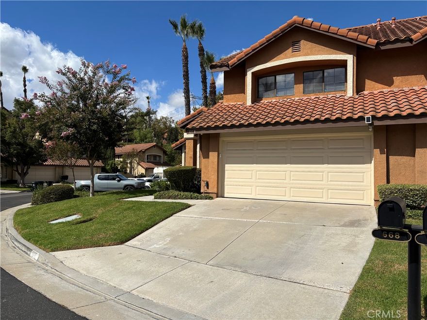 Extensively remodeled, including kitchen, baths, and flooring! Occupying a nice corner in a serene tree-line setting of Camino Grande Villa, this gorgeous home offers a luxurious living experience in picturesque Anaheim Hills. 3 bedrooms, 2.5 baths, 2 cars garage with a direct access to the house. Bright and inviting, the living room and dining room offer high ceilings, an elegant chandelier, and a glass slider to an enormous patio. Open to the family room, the upgraded kitchen boasts granite countertops, white cabinetry, all stainless steel appliances, and bar sitting. A well appointed primary suite features high ceilings, two mirror closets, and a cozy fireplace. The impressive primary bath showcases new cabinets, quartz countertops, dual sinks, attractive plumbing/light fixtures, a new shower with frameless shower door and custom soap boxes, etc. The hall bath was also newly upgraded with quartz countertop and shower walls, large tile floor, a charming mirror, and beautiful pluming fixtures. A separated family room has a fireplace with new surround and a lovely built-in bench. Fresh interior paint. New luxury vinyl planks downstairs and on the staircase. Wood floor upstairs. A newer front door with stained glass and keyless entry. Two patio glass sliders, leading to a massive patio. Nest thermostat. Laundry hook-up and epoxy flooring in the garage. Refrigerator is included. Small pets will be considered. Very near Anaheim Hills golf course, Oak Canyon nature center with lots of hiking trails, Nohl Ranch Saddle club, and shopping centers, etc. Easy access to 91, 55, and 241. Call today!