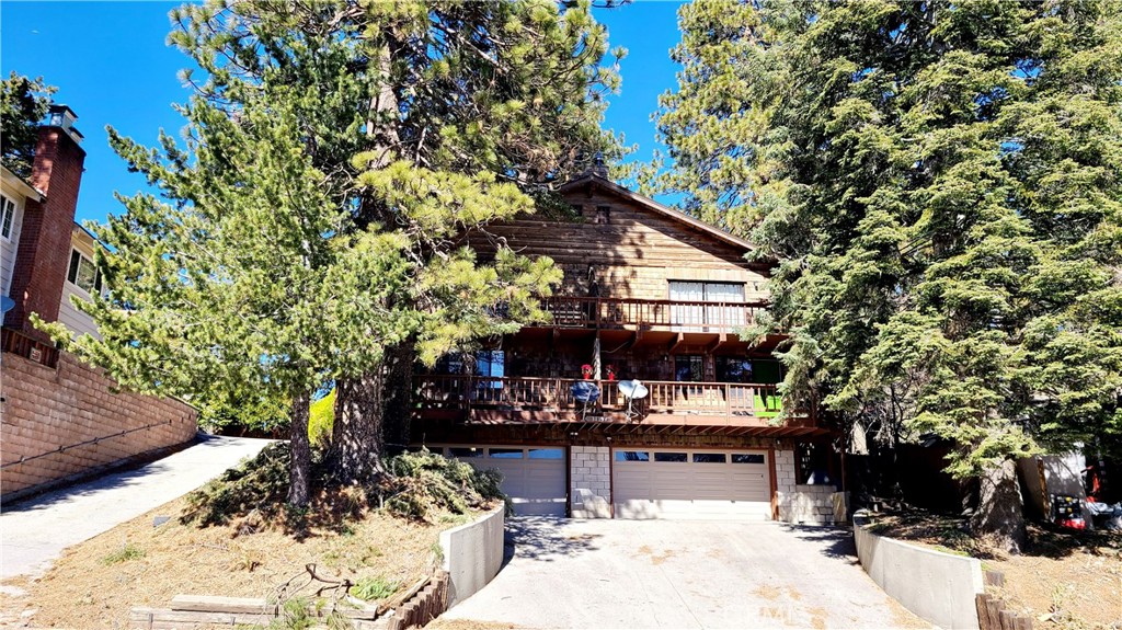 Fabulous opportunity to own the best duplex in the area! These oversized 2-bedroom, 2 bath units have oversized tandem garages with individual laundry areas as well as fenced yards, making them a rare find! The location is right off the main highway 18 for easy year-round, commuter access & is centrally located between Snow Valley Ski Resort & Sky Park At Santa's Village. Both tenants would love to stay or use one for themselves & rent the other! The main level features the large living area with a freestanding wood-burning stove & beamed ceiling, a bath & the open kitchen with a large breakfast bar. From this level, you can access the large front deck as well as the large fenced backyard. Upstairs is the master bedroom complete with a private deck, bedroom 2 & bathroom. Downstairs is the roomy tandem garage. Opportunity is knocking! Fabulous 1,440 sqft. 2 bedrooms, 2 baths, identical unit homes in the center of Running Springs. Newer kitchen appliances, custom-designed countertops, and new luxury vinyl floors throughout the home. Ceiling fans in all rooms. Over-sized 2-car garage with laundry hookups and access to the home. This centrally located home is right off the main highway 18, 12 minutes to Lake Arrowhead, 15 minutes to Snow Valley Ski Resort, one & a half miles to the town center, and Sky Park At Santa's Village is a few minutes away.