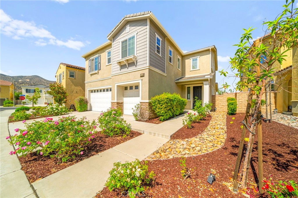 Tucked within the prestigious gated community of Westridge in Canyon Hills, this stunning residence offers the perfect blend of luxury, comfort, and style. From the moment you arrive, the manicured front yard and inviting facade set the tone for the sophisticated living that awaits inside.Step through the front door and into a spacious, light-filled living area featuring vaulted ceilings and an open-concept layout that effortlessly connects each room—perfect for both intimate family time and entertaining guests. The gourmet kitchen is a chef’s dream, showcasing rich coffee-colored cabinetry, sleek granite countertops, and an oversized island ideal for cooking, serving, or gathering around.This thoughtfully designed home includes four generously sized bedrooms and a versatile loft, providing ample space for rest, work, or play. The luxurious primary suite features a spacious walk-in closet and a beautifully appointed en suite bathroom designed for relaxation and ease.Step outside into your private backyard oasis—an ideal space for hosting summer barbecues, enjoying quiet mornings, or simply taking in the breathtaking views. From this vantage point, you’ll enjoy some of the best scenery in the community, including panoramic sunset and lake views that never get old.Safety and serenity are hallmarks of the Westridge lifestyle, where pride of ownership and a strong sense of community shine. Residents enjoy access to the nearby two-acre Summit Park, offering resort-style amenities such as a beach-entry pool, spa, outdoor showers, fire pit, picnic areas, BBQ stations, lighted basketball court, and a tot lot. There's even a dedicated dog park with separate areas for pets to play freely.Conveniently located near Railroad Canyon Road and Canyon Hills Marketplace, with shopping, dining, and entertainment just minutes away—this home truly has it all.Don’t miss your chance to own a slice of Canyon Hills luxury—schedule your private showing today before it's gone!