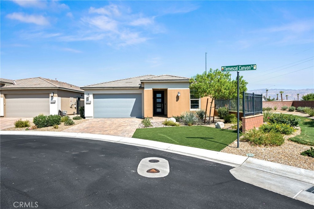 Trilogy Polo Club is Indio’s premier 55 and over community, offering incomparable amenities and a carefree lifestyle. You’re sure to be impressed by this elegant Reunion floor plan, located on a corner lot, and boasting a spacious 1928 square feet. This thoughtfully designed plan is presented in a 2 bed/2 bath configuration plus DEN, a multifunctional smart space, and a host of pleasing upgrades, sure to delight. The home is one of the largest in the community and has been designed with privacy and functionality in mind. The open concept plan features a Chef’s kitchen with stunning quartz surfaces, upgraded GE profile stainless appliance package, and soft close drawers and cabinets. The gorgeous kitchen opens up to a sizable great room, stylish DEN, and intimate dining room. The primary suite and guest bedroom are located on opposite ends of the home, creating a private and comfortable living experience. The home has been meticulously maintained and includes both front and rear yard platinum landscaping package, shade covered patio featuring ceiling stereo speakers and so much more!