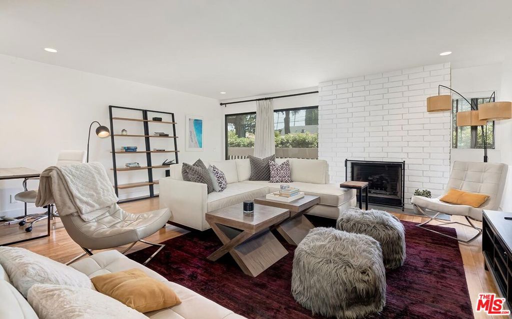Bright and inviting condo in a prime Santa Monica location, just minutes from the beach and one block from Montana Avenue's shops, cafes, and entertainment. This home is filled with natural light and features a generous living room with fireplace that opens to a large private terrace, ideal for entertaining. The kitchen has been updated with modern finishes and abundant storage. The primary suite includes an updated bathroom, a walk-in closet, and access to its own terrace with treetop views. A second bedroom is complemented by a stylishly remodeled bath and overlooks the pool and garden.