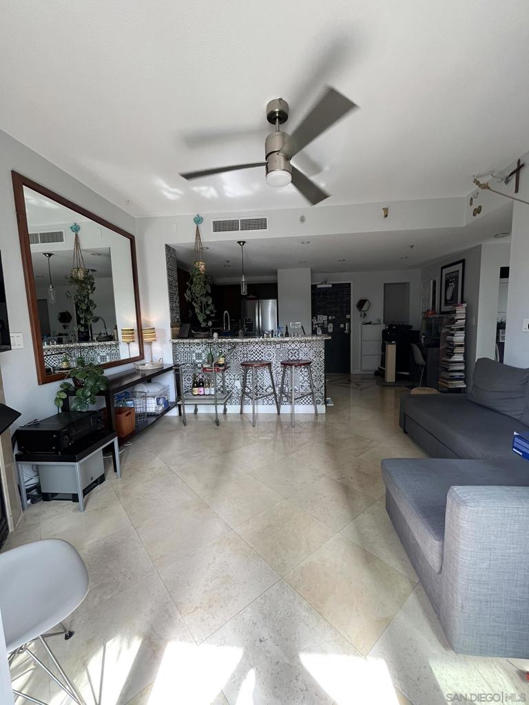 This beautifully maintained 1-bedroom, 1-bath condo offers a perfect blend of modern comfort and downtown energy. Step inside to an open floor plan with floor-to-ceiling windows, natural light, and a private balcony overlooking the cityscape. The kitchen features granite countertops, stainless steel appliances, and a breakfast bar that flows seamlessly into the spacious living area — ideal for entertaining or relaxing after a long day. The primary bedroom includes a large closet and direct access to the well-appointed bathroom. Treo residents enjoy top-notch amenities including a heated pool, spa, fitness center, BBQ area, community lounge, and secure underground parking. The building offers 24/7 security and professional on-site management for peace of mind. Located in the heart of Little Italy, you're just steps from San Diego's best dining, coffee shops, waterfront parks, and the Saturday Mercato farmers market. Minutes from the Gaslamp Quarter, Petco Park, and the airport. We welcome all Dep't of Defense (DOD).