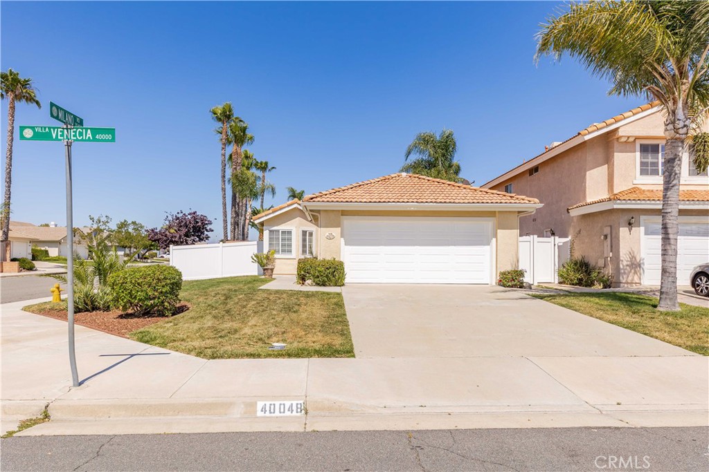 Welcome to 40048 Villa Venecia - a 1,272 square foot Temecula home on a 5,663 square foot lot with 3 bedrooms and 2 bathrooms. Loaded with heaps of curb appeal and glorious California sunshine, this property is not to miss! Upon entering the home, you will immediately notice its pristine updated floors and the fireplace that serves as the focal point of the living room. It connects to the gorgeous kitchen peppered with cabinets, stainless steel appliances, and ample workspace. Windows, lights, and ceiling fans are abundantly installed, making the home bright and airy all year round. The bedrooms have been updated with fresh new carpet and come with good-sized closets for your convenience. Relax after a long day under a hot shower in the updated bathroom or enjoy a cold soak in your cozy tub! At the back is a nice patio area that is perfect for barbecue weekend gatherings and a yard that can home your favorite plants, chill with your guests, or do some fun outdoor activities. The new vinyl fence gives you more privacy, while still enjoying the outdoor vibe. Close to restaurants, shops, and freeways, there is nothing more you can ask for! This home checks all of the boxes. Schedule a showing and make it yours!
