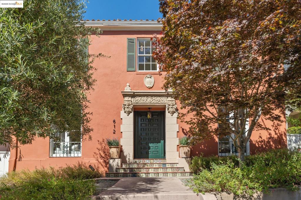 Welcome to a rare opportunity in Crocker Highlands, one of Oakland’s most walkable neighborhoods. Just steps from Lakeshore shops, eateries, and the farmers market, this spacious Mediterranean offers timeless architecture, modern updates, and an easy urban lifestyle. Inside, soaring 10-foot ceilings, rich dark wood trim, and gracious formal rooms set a warm, elegant tone. A grand living room with floor-to-ceiling windows and fireplace, and a spacious, formal dining room, are perfect for entertaining. The updated kitchen offers generous storage, recessed lighting, and a charming breakfast room with built-in hutch, ideal for casual meals or weekend brunch with friends. With five true bedrooms—including a main-level guest ensuite, four bedrooms upstairs, including a primary remodeled ensuite bath—this home offers ample space and uses. The fourth bedroom and bath has an optional separate entrance, perfect for overnight guests, in-laws, teens or live-in support. Downstairs is a dedicated room for a home gym or studio, plus a laundry room with storage This is the ideal location for the urban lifestyle, only one block to the Transbay bus stop, making your SF commute easy and convenient. Space, style and a close-in, urban location, and everything you need just out your door.