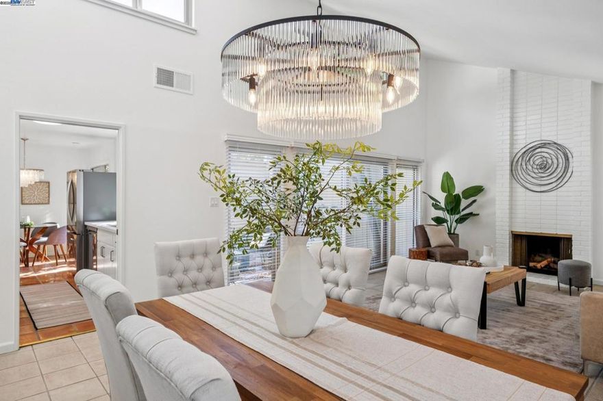 Surrounding trees create a serene setting for this sought after one-story, Model A Townhome in Bay Farm Island's Islandia community. Move-in ready, this home has been updated to meet today's creature comforts. The open floor plan with vaulted ceiling is infused with an abundance of natural light. The living room area with fireplace, access to the courtyard, and adjacent dining area, certain to become a favorite gathering area. The kitchen has been updated with quartz countertops, new stainless steel finish appliances and one basin sink. An adjacent eat-in area with access to the private, low maintenance courtyard, make this kitchen perfect for meal preparation and entertaining. Separate from the living spaces, a spacious ensuite bedroom with walk-in closet, and a second bedroom and bath;  great for pampering and relaxation at the end of the day. Additional amenities include an interior laundry room and detached 2-car garage. In close proximity to highly ranked schools, Corica Park Golf Course, Harbor Bay/SF Ferry and bay trails, 880 and OAK International Airport, make this a perfect place to call home whether you are downsizing or rightsizing. Make this your new home for the holidays! We look forward to your visit. Alameda ~ Island Living at its best!