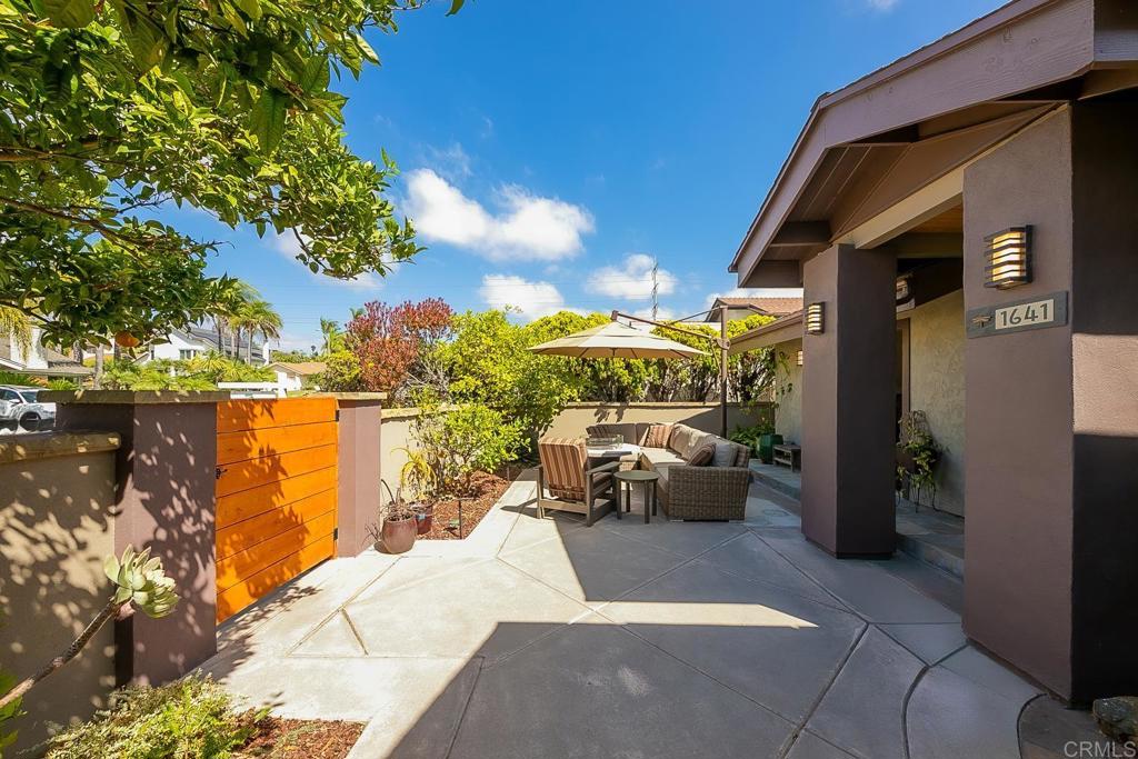 NEW: Seller will entertain offers between: $2,000,000 and $2,099,000. Meticulously designed residence, 1641 Tucker Lane is the culmination of years of craftsmanship. A picturesque gated front garden welcomes you home through a custom front door entry with custom waterfall feature that opens to soaring ceilings and an open- concept floorplan with two ensuite bedrooms and an office downstairs, and two bedrooms and everyday room (living & game room) w/ fireplace upstairs, providing unrivaled utility and flexibility. Bathed in natural light, the redesigned gourmet kitchen features custom shaker wood cabinetry, Patagonia slab stone countertops, premium stainless steel appliances (including a 2022 LG ThinQ refrigerator, Bosch dishwasher and gas range with hood). Expanded kitchen includes prep-sink, additional pantry storage and breakfast dining nook. Contemporary design elements throughout. Downstairs primary suite boasts a luxurious bathroom with a Signature Hardware Sheba air bubble tub, Hollyn vessel sink faucets, Quartz Carrera countertops, and a stunning shower with Bellmeade Greige polished porcelain and Black Hex slate mosaic. Additional bathrooms feature high-end finishes like James Martin and Becker teak vanities, Kohler toilets, and modern fixtures. Enjoy spacious rear yard with carefully manicured garden & koi pond water feature, perfect for outdoor living, plus washer/dryer upstairs & downstairs for convenience. Walkable to Encinitas Village Square shopping, local schools, and parks, this home combines coastal charm with modern elegance—a true contemporary masterpiece