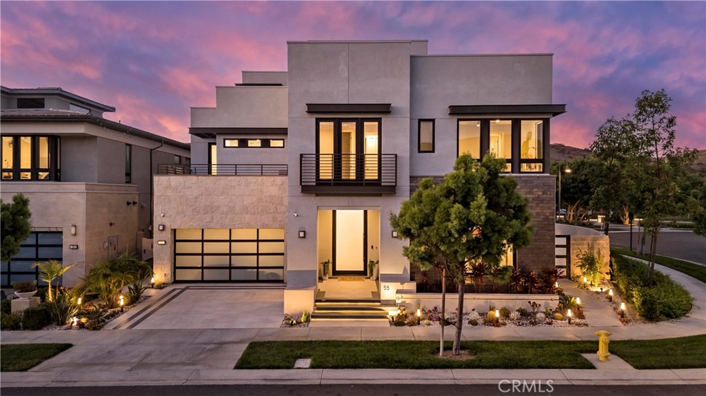 Welcome to 55 Hartman – Irvine’s Ultra-Modern Three-Story Estate in the Prestigious Guard-Gated Community of Altair.
This architectural masterpiece offers 5,029 sqft of luxurious living on a private 7,500 sqft corner lot. With striking design, rare vertical space, and seamless indoor-outdoor flow, this one-of-a-kind residence sets a new benchmark for modern elegance in Irvine.
Step inside to a dramatic 3-story foyer with floor-to-ceiling windows that flood the home with natural light. The fully integrated Control4 Smart Home system allows effortless control of lighting, audio, climate, security, and motorized window treatments.
The expansive great room connects to the backyard through a full wall of sliding glass doors that pocket into the wall, creating a true indoor-outdoor living experience. The adjacent sunroom, with motorized shades, transforms into a tea room, children’s playroom, or lounge.
The chef’s kitchen boasts a massive quartz island, professional-grade stainless steel appliances, and custom cabinetry, flowing into a bright dining area and open-concept living space—perfect for everyday luxury or entertaining guests.
The resort-style backyard includes a sparkling custom pool and spa, a sunken firepit lounge, and a built-in BBQ island, ideal for alfresco gatherings. Lush landscaping is maintained by an automated irrigation system for year-round ease.
Upstairs, the elegant primary suite offers two custom walk-in closets and a spa-inspired bath with soaking tub, dual vanities, and glass shower. The third floor has been enclosed and reimagined as a peaceful tea room with large windows and a flexible entertainment area with wet bar and half bath.
This home features nearly 1 milliion in high-end upgrades throughout, including designer finishes, custom details, and cutting-edge smart technology—delivering a lifestyle of sophistication, comfort, and effortless luxury.
Altair offers world-class amenities including a 7,000 sqft clubhouse, resort pools, tennis courts, parks, and fitness centers. Minutes from Irvine Spectrum, Great Park, and award-winning Irvine Unified schools.