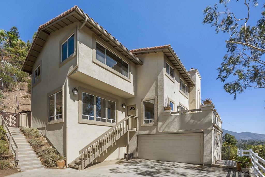 Experience elevated living in the coveted Mt. Helix area, this beautifully upgraded 4-bedroom, 2.5-bath home offers 2,872 sq ft of light-filled living space with vaulted ceilings, scenic views, and thoughtful design throughout. The chef’s kitchen features ample counter space and flows into a bright dining nook with views, while a large, private formal dining room provides the perfect setting for entertaining. The spacious family room includes a cozy fireplace, and the luxurious primary suite offers its own fireplace, a private balcony, and a massive walk-in closet with custom organizers. Additional highlights include tile flooring that mimics hardwood, central AC, gas/electric heating, and a dedicated upstairs laundry room. Energy-efficient living is made easy with 21 fully paid solar panels and a battery system, helping offset the monthly bill. The attached 2-car garage includes two large storage rooms, and the fenced yard and durable tile roof add to the home’s long-term value. Ideally located just minutes from major freeways, shopping, dining, parks, and schools, this home offers comfort, convenience, and community in one of East County’s most desirable neighborhoods.