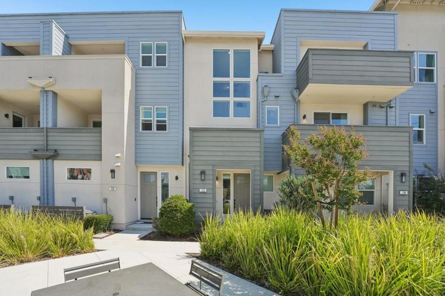 Welcome to this stunning newer-construction top-level condo, offering two private bedroom suites plus a powder room. Bright and airy with abundant natural light, the home showcases an inviting open-concept design featuring a spacious great room, engineered wood floors, and a gourmet kitchen with a large island, quartz countertops, white cabinetry, and GE stainless steel appliances. Enjoy seamless indoor-outdoor living with a balcony off the main living area and open park space outside the front door. EV charging in the 2 car side by side garage. We   Located in a vibrant new urban town, residents enjoy 3 acres of parks, a community garden, basketball court, playground, and picnic area. Perfectly situated for convenience, the community is just within a short walking distance from Costco and with an easy commute to Apple, LinkedIn, Nvidia, Facebook, Google, etc and CalTrain station. This home blends modern luxury, effortless style, and unbeatable convenience.