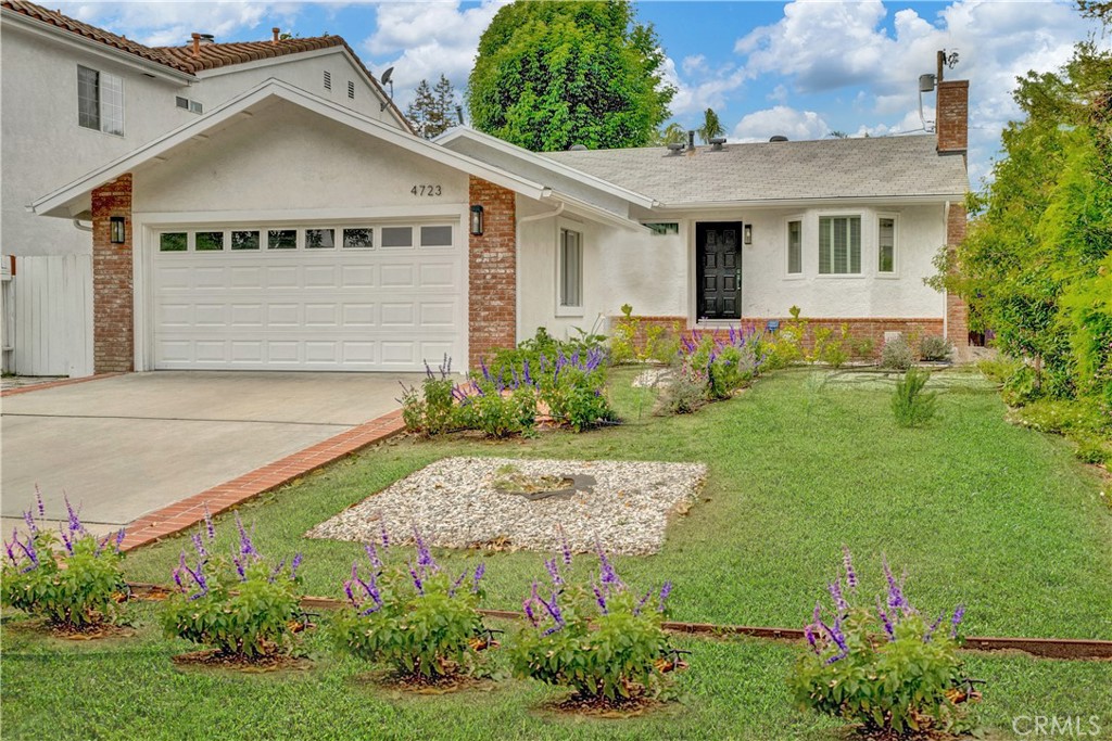 Located in one of the most desirable Sherman Oaks neighborhoods with award winning schools. This beautifully updated and tastefully painted charming house offers a fantastic floor plan perfect for indoor/outdoor entertaining. Step into the inviting living room featuring a stunning marble fireplace, recessed lighting, recently updated flooring.
The open-concept kitchen and dining area flow seamlessly, highlighted by quartz countertops, stainless steel appliances, self-closing cabinetry, and French doors that lead to a charming brick patio, a fire pit, and beautiful paved spaces for entertainments with plenty of shade to enjoy during the warm days.
The spacious primary suite opens through French doors to a second patio — an ideal spot for your morning coffee or evening wine. Both bathrooms have been fully renovated with dual vanities and high-end finishes.
Enjoy the summer with a brand new central air conditioning system, and your private backyard oasis filled with fruit trees including orange, tangelo, lemon, and peach. The home offers an attached-oversized two-car garage that provides ample storage and parking. Grass has been virtually added to the front of the house picture.