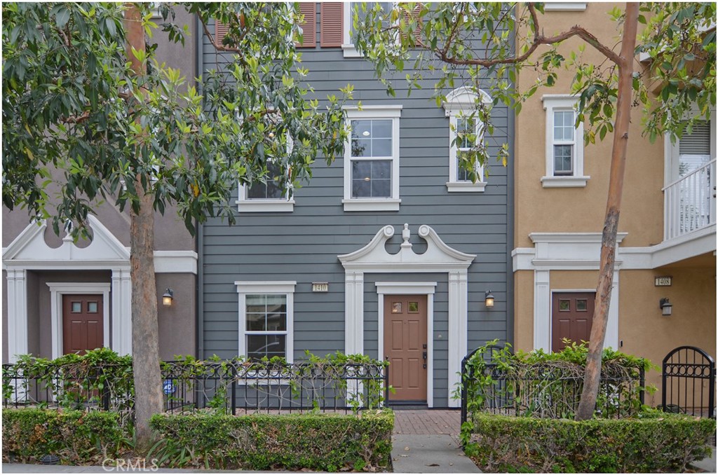 Welcome to your dream townhouse in Tustin! This stunning 3 bedroom, 2.5 bathroom home is nestled in a sought-after Columbus Square neighborhood, offering both comfort and convenience. Freshly painted and new flooring throughout. The only carpet is on the staircases. Step inside and discover a world of modern elegance combined with thoughtful design. As you enter, you'll be greeted by the spacious living room adorned with luxury vinyl plank flooring and a cozy electric fireplace, creating a warm and inviting atmosphere. Adjacent to the living room, the kitchen showcases sleek granite countertops, oversize granite center island and top-of-the-line stainless steel appliances. Upstairs, you'll find two generously sized bedrooms, each offering a private oasis for rest and rejuvenation. The primary bedroom boasts ample space, an en-suite bathroom, and a walk-in closet to accommodate your storage needs. The second bedroom with an ensuite bath, provides a versatile space, perfect for guests, a home office, or a hobby room. The third bedroom is located on the first floor with a modern style barn door. (This bedroom does not have a closet) Additional features include a 2-car garage for secure parking and extra storage, as well as convenient washer and dryer hookups for added convenience. Situated in the vibrant city of Tustin, this townhouse offers easy access to a wide range of amenities. Enjoy proximity to shopping centers, parks, renowned schools, and a thriving dining scene. Commuting is a breeze with major highways and transportation options just moments away. Don't miss the opportunity to make this exquisite townhouse your own. Schedule a viewing today and embark on a new chapter of modern living in the heart of Tustin, California. Paint touch ups, carpet cleaning and deep cleaning are scheduled.