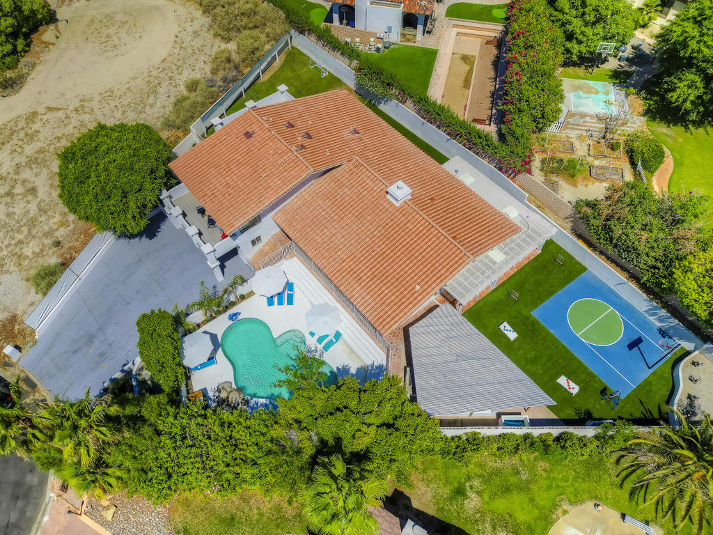 Incredible opportunity for investors, 1031 exchange buyers, or anyone seeking a higher CAP rate which will beat most long term rentals and will generate steady passive income for years to come.This beautifully appointed 5-bedroom, 4-bath home with a dedicated game room is located in the heart of Bermuda Dunes, a prime short-term rental market known for its proximity to world-class attractions.Sitting on an expansive 13,939 sq ft lot at the end of a cul-de-sac, the home is thoughtfully designed for maximum guest enjoyment and repeat bookings. The gated pool, outdoor half basketball court, covered kitchen with gas fireplace, multiple lounge areas, horseshoe pit, and room to add a pickleball court create the ultimate outdoor entertainment space.Interior features include:High-end designer furnishings (included in sale)Fully stocked gourmet kitchenFlexible layout offering up to 5 fully furnished bedrooms with two private balconies with gorgeous mountain views.Dedicated game room with pool table, foosball table, private bathroom and its own AC unit. This home has the wow-factor that will satisfy the most discerning investor or family looking for a forever home which is near some of the best schools in the whole desert.This home has proven income performance, grossing $186,535 in the last 365 days, with $32,000+ in future bookings ready to transfer to the next owner--making this a true turnkey investment.The Ideal location is unbeatable and just minutes to:Indian Wells Tennis GardenCoachella & Stagecoach festival groundsSurf clubs and water parksEl Paseo Shopping District (the Rodeo Drive of the desert)Old Town La Quinta with fine dining and boutique shopsAnd easy access to I-10 freeway for quick travel to Palm Springs or beyond.Whether you're expanding your STR portfolio or seeking a vacation home that pays for itself, this property offers an unbeatable combination of luxury, location, and income potential.Shown by appointment only. Financials available upon request.