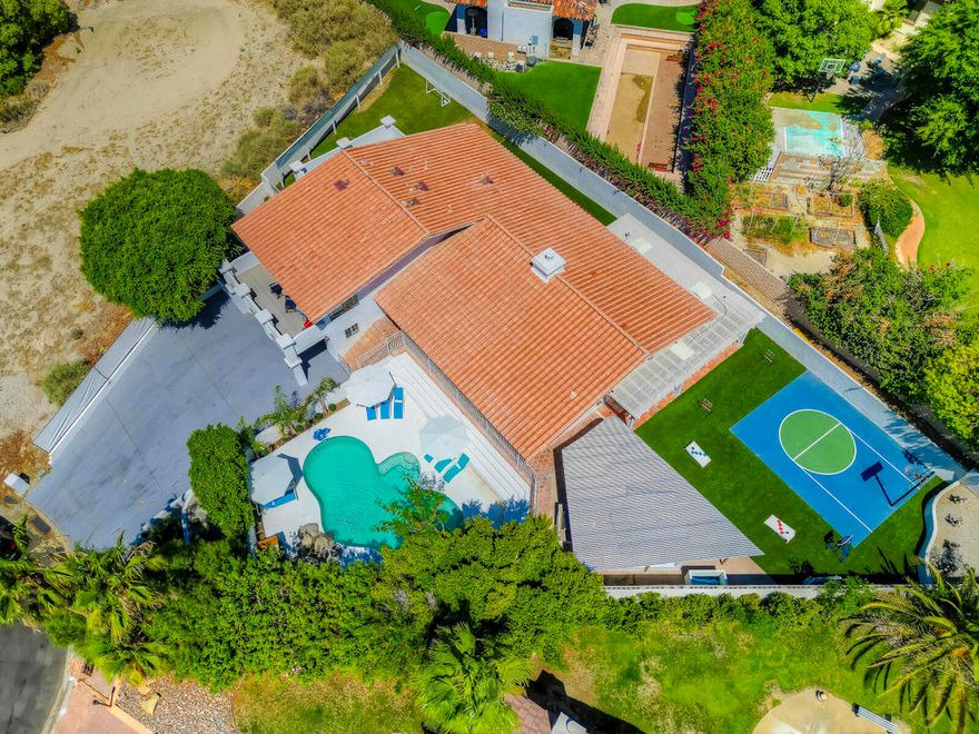 Incredible opportunity for investors, 1031 exchange buyers, or anyone seeking a higher CAP rate which will beat most long term rentals and will generate steady passive income for years to come.This beautifully appointed 5-bedroom, 4-bath home with a dedicated game room is located in the heart of Bermuda Dunes, a prime short-term rental market known for its proximity to world-class attractions.Sitting on an expansive 13,939 sq ft lot at the end of a cul-de-sac, the home is thoughtfully designed for maximum guest enjoyment and repeat bookings. The gated pool, outdoor half basketball court, covered kitchen with gas fireplace, multiple lounge areas, horseshoe pit, and room to add a pickleball court create the ultimate outdoor entertainment space.Interior features include:High-end designer furnishings (included in sale)Fully stocked gourmet kitchenFlexible layout offering up to 5 fully furnished bedrooms with two private balconies with gorgeous mountain views.Dedicated game room with pool table, foosball table, private bathroom and its own AC unit. This home has the wow-factor that will satisfy the most discerning investor or family looking for a forever home which is near some of the best schools in the whole desert.This home has proven income performance, grossing $186,535 in the last 365 days, with $32,000+ in future bookings ready to transfer to the next owner--making this a true turnkey investment.The Ideal location is unbeatable and just minutes to:Indian Wells Tennis GardenCoachella & Stagecoach festival groundsSurf clubs and water parksEl Paseo Shopping District (the Rodeo Drive of the desert)Old Town La Quinta with fine dining and boutique shopsAnd easy access to I-10 freeway for quick travel to Palm Springs or beyond.Whether you're expanding your STR portfolio or seeking a vacation home that pays for itself, this property offers an unbeatable combination of luxury, location, and income potential.Shown by appointment only. Financials available upon request.