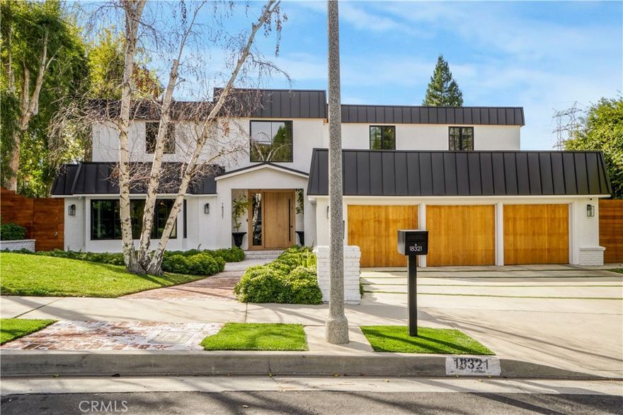 Nestled in the quiet and serene neighborhood of Encino Hills and surrounded by mature trees, this recently and completely renovated home offers stunning views and a thoughtfully designed floor plan featuring five spacious en-suite bedrooms, a powder room and library that could also function as a playroom. The expansive primary suite includes a large walk-in closet and a peaceful seating area, creating a true retreat. A beautiful wooden deck on the second floor, extending across the length of the house, provides a panoramic viewing point. The gourmet kitchen boasts high-end stainless steel appliances and custom cabinetry, complemented by abundant natural light throughout the home. Set on nearly half an acre, the property features a sparkling pool and jacuzzi—both with new tile and plaster—a dedicated dog run, fruit trees, and a vegetable garden. The yard is thoughtfully divided into several seating areas, perfect for relaxation and entertaining. Additional highlights include a three-car garage, integrated smart home technology for convenience and security, and a community tennis court. Elegant interior finishes evoke a relaxed yet refined atmosphere. This home is perfect for entertaining or simply relaxing and enjoying the serene surroundings.