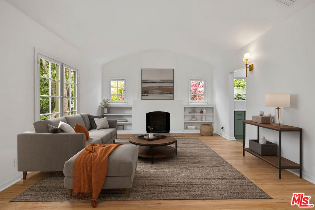 New Co-Ownership Opportunity: Settle into a mint-renovated Spanish Colonial TIC home in West Hollywood. This bright and charming 2-bedroom, 1-bath unit is situated on a quiet, tree-lined street and features a private yard and garage. This thoughtful renovation incorporates modern necessities while preserving a 1920s vibe. New interiors feature a cook's kitchen with solid wood custom cabinets, gorgeous quartz countertops and backsplashes, chic Espresso appliances, high-end faucets and hardware, a drinking water filtration system, a convenient under-counter microwave drawer, and a large stacked washer-dryer. Bathrooms are outfitted with custom tiles, a solid Oak vanity with a marble top, and a lighted, mirrored medicine cabinet to hold all of your beauty accessories. With hardwood floors, antique gold fixtures, the original fireplace, and a privacy hedge that surrounds your garden, this adorable cottage-style TIC home is ready for its close-up. Pet-friendly and walking distance to Plummer Park, Poinsettia Recreation Center, Trader Joe's, Smart & Final, and numerous shops, restaurants, and cafes on Santa Monica Boulevard in WEHO.