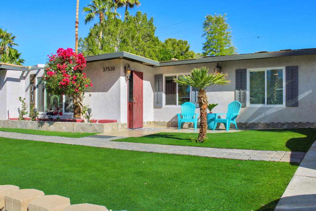 Charming Midcentury Property with Endless Potential in ONE of the quietest streets in the Cathedral City Cove. Surroundings homes have upgrades in excess of $800,000. Overflowing with character, this midcentury home is a rare opportunity nestled in the desirable Cathedral City Cove. Ideally situated on a gently sloping street, it's just a short walk to downtowns' movie theaters, shops, and restaurants. The expansive backyard is a private oasis featuring synthetic grass, lush landscaping, with plenty of room to add a pool. A single-car garage with dual parking driveways. Inside, you'll find a cozy living room with a unique fireplace. The one of a kind antique cabinetry kitchen opens directly to the backyard and covered patio, perfect for indoor-outdoor living. A separate laundry room adds convenience.