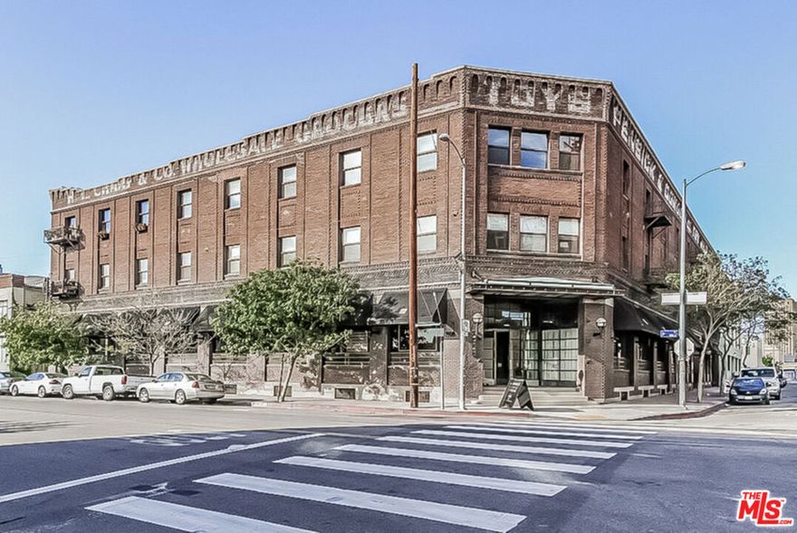 New York style Live/Work Loft perfect for artist or business at The Toy Warehouse building. Open floor plan, hardwood floors, gorgeous brick walls, high ceilings, large bathroom, stainless appliances, washer, and dryer inside. Great city views. Two parking spaces included and guest parking in the building. Small and private building. Located in the Arts District and a short walk to many restaurants and entertainment.