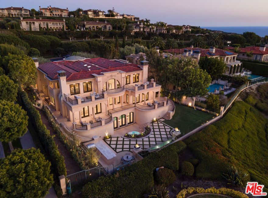 Rarely offered but highly sought after, 1 Island Vista is a newly reimagined & reconstructed estate in the ultra-exclusive, guard gated community of Pelican Crest. Championed on an oversized corner lot to emphasize the dramatic frontage & unparalleled curb appeal, this property offers expansive scenes of the Pacific Ocean's sparkling blue waters, & rolling cliff sides of Catalina Island, providing a surreal backdrop from nearly every room. Upon arrival, an impressive limestone entryway leads to a double Foyer that rivals the lobbies of the world's finest hotels - setting the tone of sophistication & refinement to be experienced throughout. This open-concept custom estate provides seamless transitions between the living room, chef's kitchen, & multiple outdoor spaces, allowing one the opportunity to host large-scale gatherings while maintaining the warmth & practicality sought after in everyday living. Characterized by imported custom Stonework on every countertop, Herringbone French Oak flooring, & magnificent crystal chandeliers throughout, this property sets an unprecedented standard for design through its careful selection of the richest materials, lustrous textures, & serene patterns. The gourmet chef's kitchen, featuring commercial grade professional appliances, Calcatta Borghini marble countertops, & bespoke cabinetry throughout; lies adjacent to the living room, which is highlighted by multiple sets of French doors & features Savant Smart Home w/ Lutron lighting throughout. Upstairs, the generously appointed primary suite spans the entire length of the home. The spacious primary bathroom wrapped in book-matched Italian marble, oversized his + her vanities, features an oversized steam shower with multiple jet & rain shower heads. An oversized, "dream" walk-in closet boasting Cleef cabinetry, custom lighting, & a Miel coffee maker, sets the scenery for a perfect morning routine. Downstairs, a limestone slab, UV & Ozone purified indoor pool, wet bar with custom marble countertops, tailor-made cabinetry, and a classic hot rock squabble sauna provides a level of accommodation surpassing the luxury spa at your favorite resort. A private entertainer's backyard, enveloped with hedges and seasonal florals, is complemented by symmetrical fire features & mature Mediterranean landscaping, completing the atmosphere of excellence that distinguishes this property from any other. This once-in-a-lifetime opportunity to own this generational treasure is a dream brought to life.