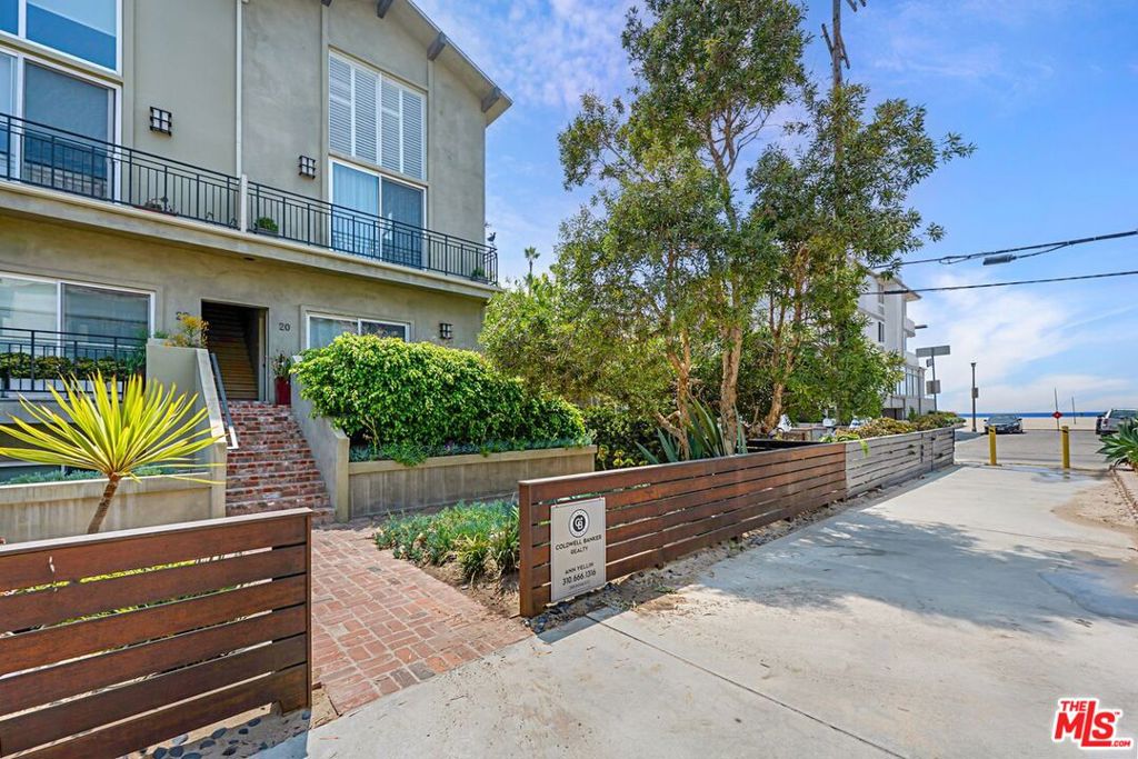 Steps from the sand! This upper front corner condo on the coveted Marina del Rey Peninsula combines coastal charm, modern comfort, and ocean views. With 2 bedrooms, 2 baths, a spacious loft, and a huge private rooftop deck, it's the perfect beachside retreat. Soaring ceilings and walls of windows fill the two-level layout with natural light and fresh sea breezes. The chef's kitchen features a GE Monogram refrigerator, Viking range, granite counters, and seamless flow to the dining area and living room with a wood-burning fireplace and ocean views. Upstairs, the loft with distressed wood floors offers flexible space for an office, studio, or guest room and opens to a generous rooftop deck ideal for lounging, dining, or gardening. The serene primary suite has its own balcony, and both bedrooms are on the main level for convenience. .Additional highlights include hardwood floors throughout, in-unit laundry, a two-car attached garage, and bike storage. Located on a quiet walk street just moments from the sand, Washington Square, Venice Beach, scenic bike paths, Coeur D'Alene Elementary, and top restaurants.Enjoy the best of Silicon Beach living steps to the ocean, minutes to everything.