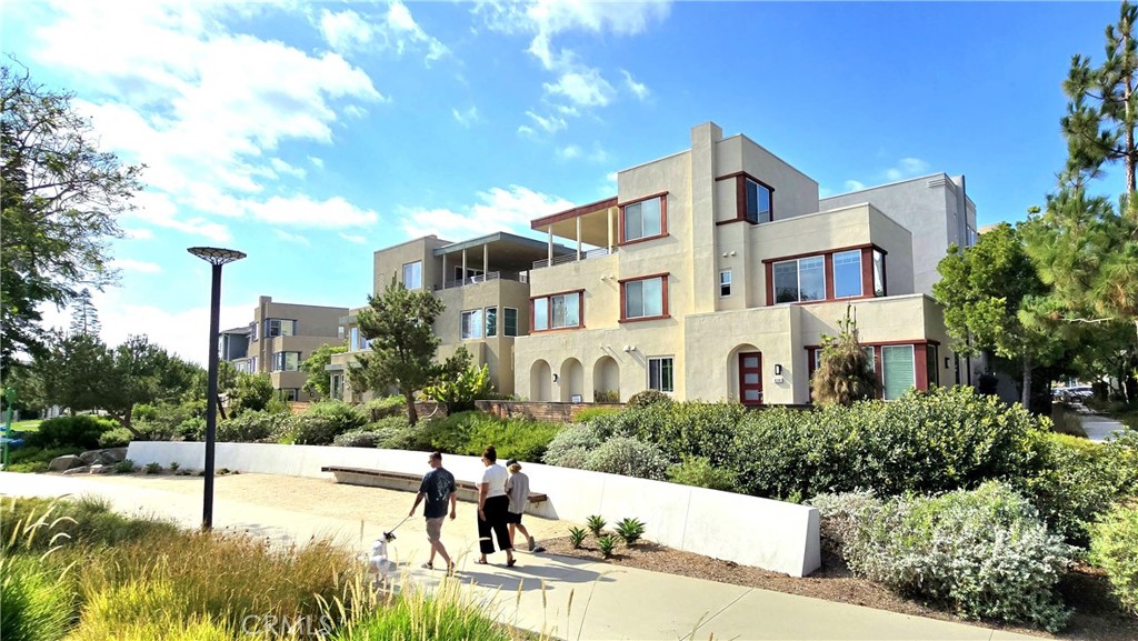 Nestled in Irvine's vibrant Great Park Cadence Neighborhood, this modern detached condo offers stylish living with 4 bedrooms and 4 bathrooms (2 full, 2 half). The south-facing home is filled with natural light and features an open-concept floor plan with a gourmet kitchen & stainless-steel appliance, a large island flows into the bright and airy great room, perfect for family time and entertaining. Main floor kitchen prevents you from carrying heavy groceries climbing stairs.
On second floor, all four bedrooms provide comfort and three of them including master suite are facing the lush green belt, which provides valuable space and privacy. A third-floor huge loft with its own counter, sink and half bath, opens to a covered patio ideal for enjoying views of the orange balloon and the sunset.
The prime location of this property is rare to see on market. This end unit is not narrowly cramped to the neighbors, but wide open to the green belt. It's a short walk to Cadence Park's top-tier amenities - including a community park, saltwater pool, playgrounds, and trails. This home has the price of a detached condo, but lives like a single-family home, the beautiful extra-long fenced front yard is filled with scent of lavender, rosemary, and other herbs and plants, perfect to relax with a cup of coffee or tea, while greeting neighbors who's taking a stroll on the Art Walk.
This home is in the award-winning Irvine Unified School District, Cadence Park K-8 is a few houses away and Portola High is a mile away. Single low HOA dues, close proximity to parks, shopping, and John Wayne Airport (about 13 miles), residents have access to amenities of all Great Park neighborhoods.
Great Park is the hub for sport events and recreational activities, offering a wide array of attractions and amenities, like wild water park, ice rink, farmers market, summer concerts, movie on the lawn, etc. It's known for its family-friendly atmosphere and hosts numerous events throughout the year. Great Park is a vibrant destination for both residents and visitors. Cadence Park community has its own modern amenities like heated pool, separate baby pool, jacuzzi, outdoor kitchen, art gallery, library, dancing studio and activity room, beach volleyball court, amphitheater, playgrounds, music court, etc. This home blends luxury, location, and lifestyle you and your family deserve.