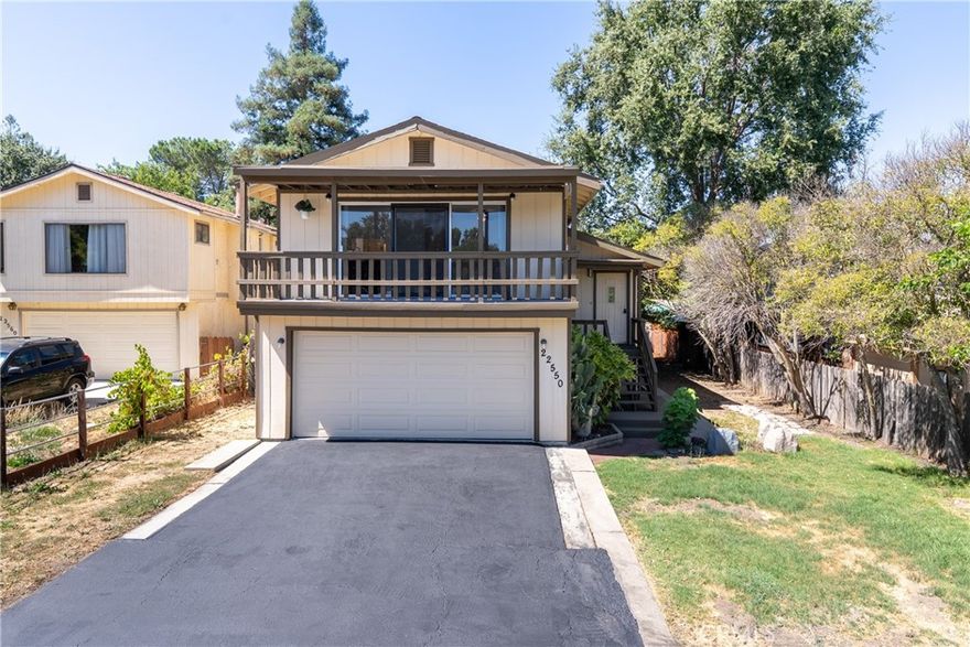 Welcome to this bright and inviting 3 bedroom, 2.5 bathroom home offering 1532 sf of comfortable living in a highly desirable location. The unique split-level floor plan is thoughtfully designed to enhance everyday life, placing the living room, dining area and kitchen on the upper level to capture abundant natural light and scenic views. Laminate wood flooring runs throughout the main living spaces, complementing the open, airy feel. Enjoy seamless indoor-outdoor living with a covered front balcony—perfect for morning coffee, evening relaxation or entertaining guests. The main level features a spacious primary suite with direct access to the backyard, along with two additional bedrooms and a full bathroom. On the lower level, you'll find an indoor laundry room with ample storage, a convenient half bath and a generous two car garage with a brand new garage door. Step outside to a fenced backyard complete with a large deck—ideal for entertaining, gardening or simply unwinding. There's plenty of room to play, relax and bring your vision to life. Situated in the heart of Santa Margarita, this home offers the charm of small town living and easy access to hiking, wineries and outdoor adventures. Don’t miss your chance to make this wonderful home your own!