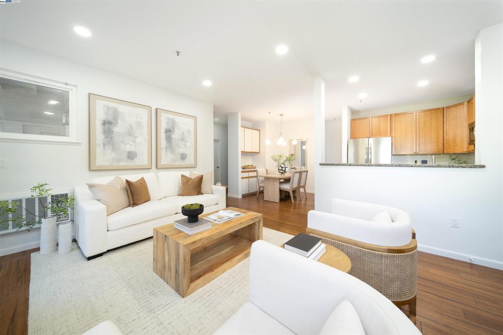 Welcome to a rare opportunity for contemporary living in Downtown Fremont. This 3-bedroom, 3-bathroom corner unit at Alta Mar Villas is a study in modern design and urban convenience. The open floor plan is defined by beautiful bamboo floors that guide you through the main living area. The kitchen is a highlight, with its refined granite countertops and a new Frigidaire refrigerator, creating a functional hub for daily life. Thoughtful planning is evident throughout, with three full bathrooms and two bedrooms featuring private ensuite baths. The home's practicality is further enhanced by its in-unit laundry and a dedicated storage closet on the expansive private patio—a true extension of the living space. The Alta Mar Villas community is an amenity-rich environment with a large pool, a well-appointed gym, and a clubhouse. The location is the final touch, placing you directly in the city's dynamic core with quick access to Silicon Valley's major employers, local festivals, and the recreational beauty of Lake Elizabeth. This is modern living, designed for you.