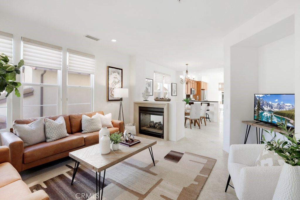 Tucked away in the scenic neighborhood of Quail Hill, this exceptional detached home at 118 Tall Oak offers a grand opportunity to live in the heart of Irvine in one of Orange County’s most prestigious and picturesque communities. Situated on a prime rear lot with a private side yard and hillside views, this beautiful Ivy Wreath residence blends luxury, comfort, and effortless California living. Spanning 3 bedrooms and 3.5 bathrooms, the thoughtfully designed floor plan caters to modern lifestyles, featuring a main-level suite with full bath—perfect for visiting guests or multigenerational living. The second level opens to a sun-filled great room with soaring ceilings, elegant dining space, half bath, and a chef-inspired kitchen adorned with stainless steel appliances and abundant cabinetry. A cozy fireplace anchors the space, while 2 private decks offer the ideal spots for grilling, morning coffee, and enjoying peaceful sunsets. Upstairs, the master bedroom with en suite bathroom serves as a tranquil retreat with dual vanities, remodeled shower, and tall windows inviting in natural light. The large third bedroom and another full bathroom complete the third level. A unique, separate tech loft adds flexibility for a home office or study nook, and the private side yard provides a lush escape—perfect for unwinding or entertaining. Located around the corner from Knollcrest Park, pools, spas, tennis courts, fitness center, and 2 blocks from Alderwood Elementary, this home is zoned for award-winning Irvine Unified schools, including University High. With close proximity to amazing hiking trails, freeways, Spectrum Terrace, Irvine Spectrum, and Laguna Beach this is elevated living at its best—where nature, luxury, and convenience come together and make it the very best place to live.